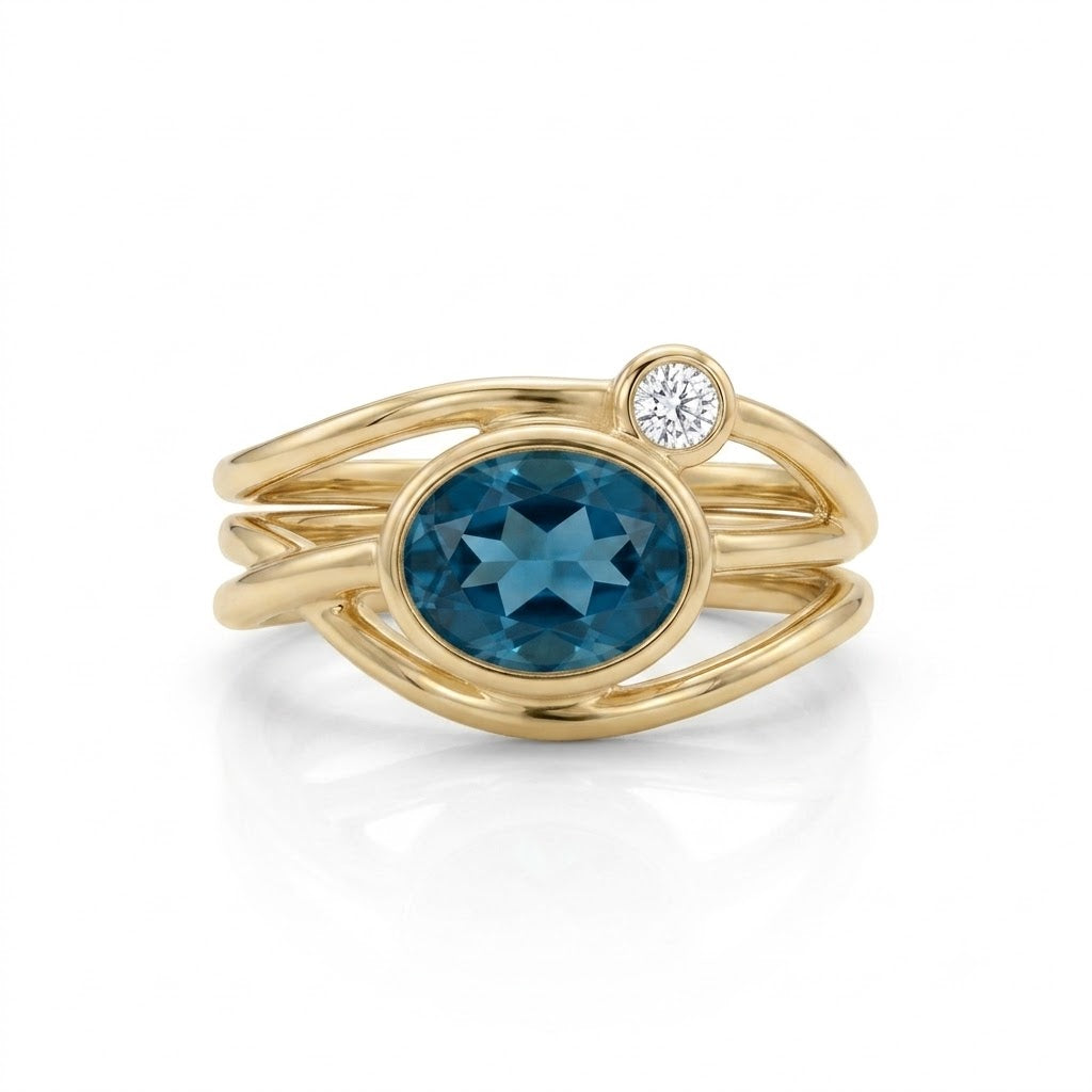Athena vikle ring med london blue topas og brillant